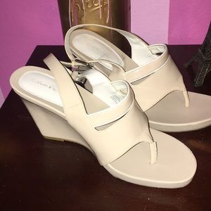 Beige wedges with white outline